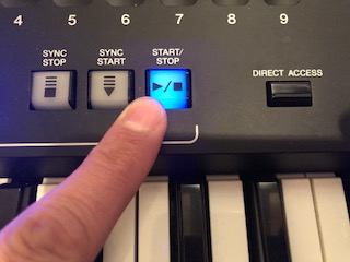 10_aifingered Finger pressing button on electronic keyboard panel.