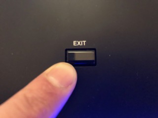 3_aifingered A finger presing "exit" button.