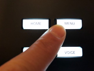 4_aifingered A finger pressing the menu button.