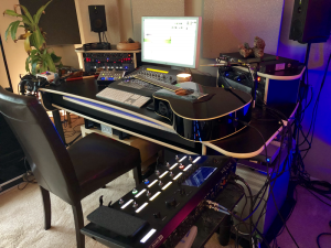 breakingamishbodyimage1 Acoustic guitar on desk next to laptop.