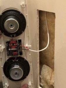 connecting-speakers800 Closeup showing the back of the speaker with wiring into wall.