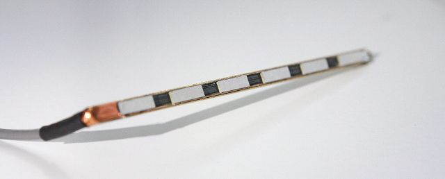 p5_SRT-Zero-Impact-PU Closeup of long thin L-shaped piece of metal.