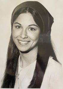 A young girl looking directly at the camera.