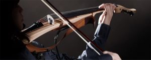 An electric violin being bowed.
